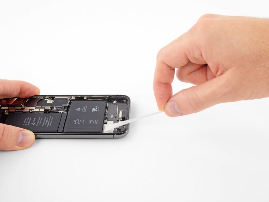 Repair Specialist Completing An iPhone X Battery Replacement