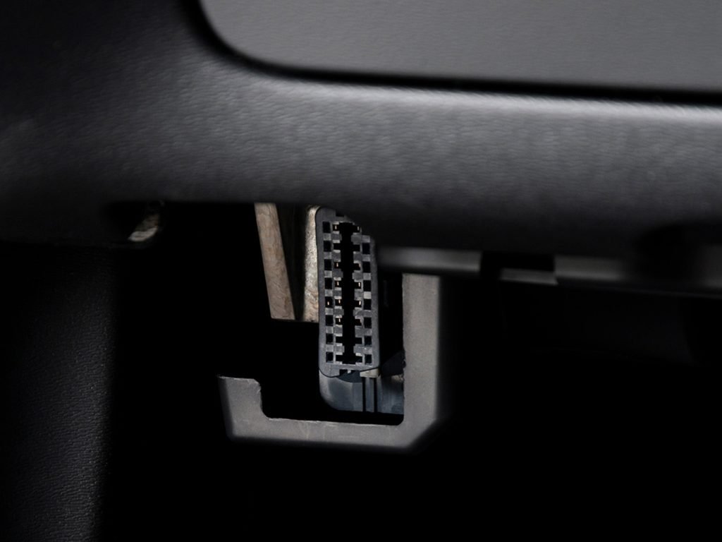 An OBD Port On A Car Used For Firmware Diagnostics Data