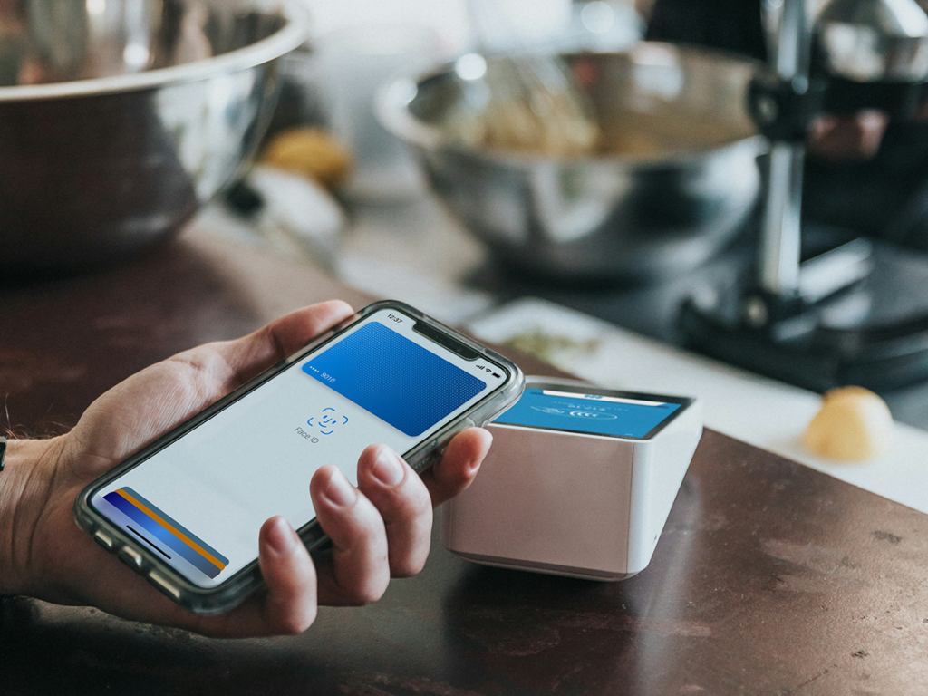 Apple Pay On iPhone At Cafe